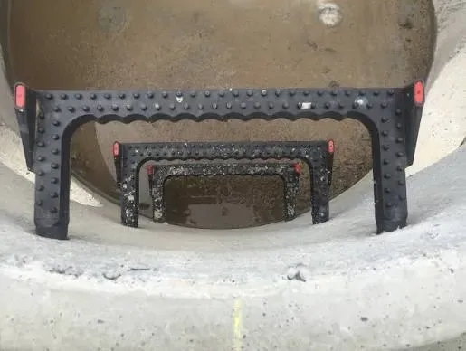 Black manhole steps installed in a precast concrete chamber